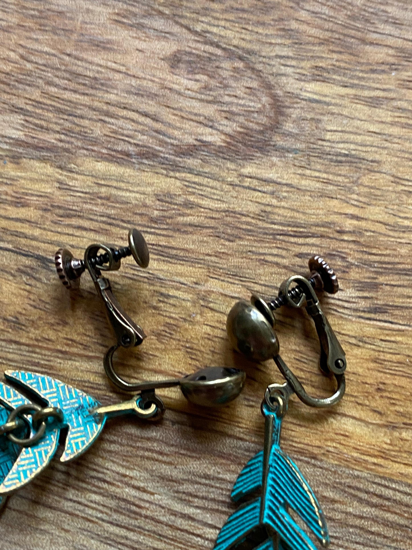 Dangling bronze feather/leaf clip on earrings (Hinged screwback closures)