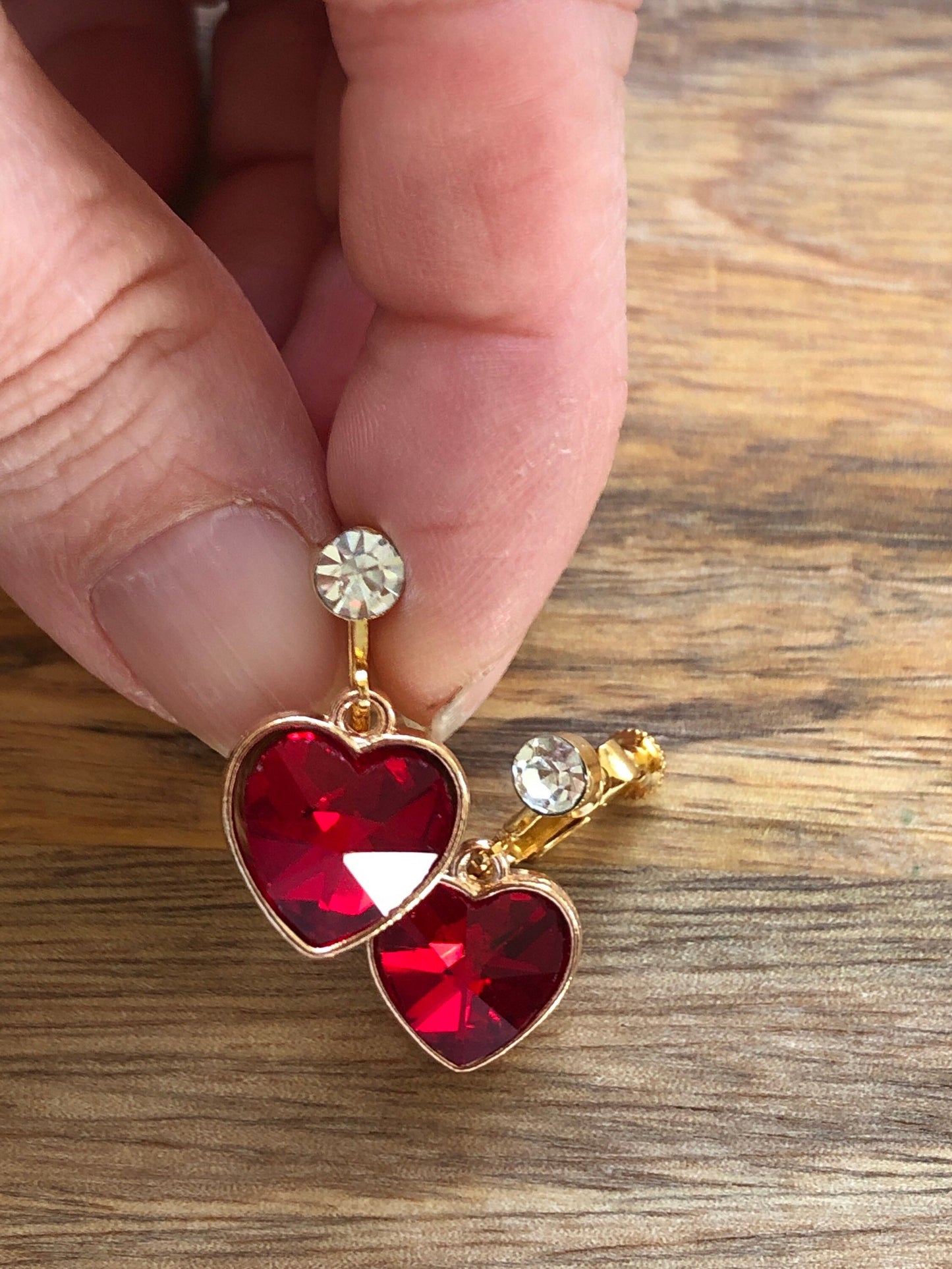 Clip on rhinestone heart earrings, dangling heart earrings with hinged screwback closures.