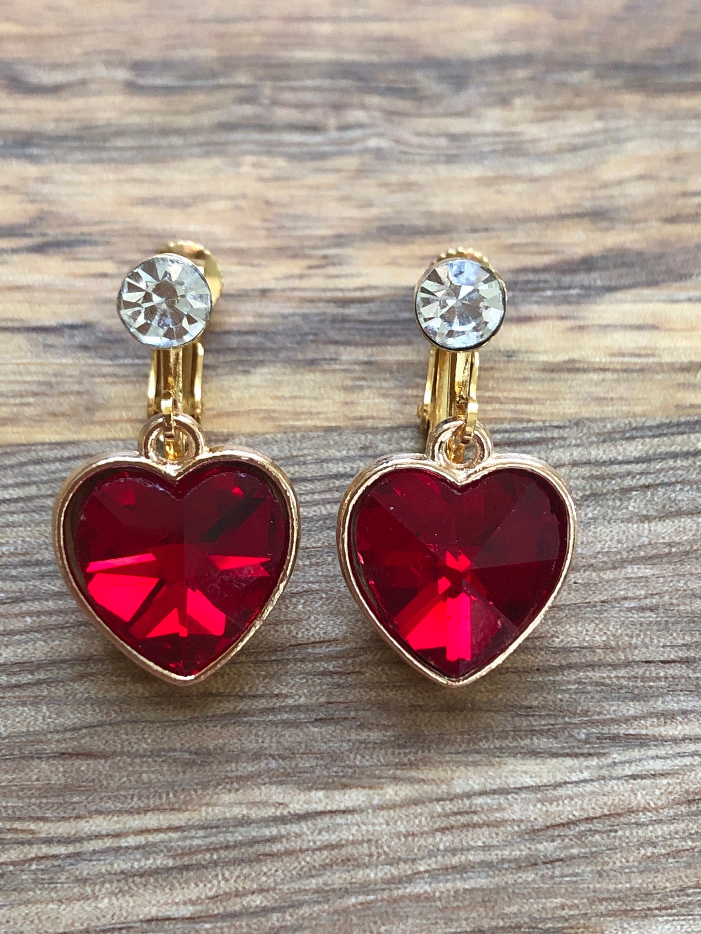 Clip on rhinestone heart earrings, dangling heart earrings with hinged screwback closures.