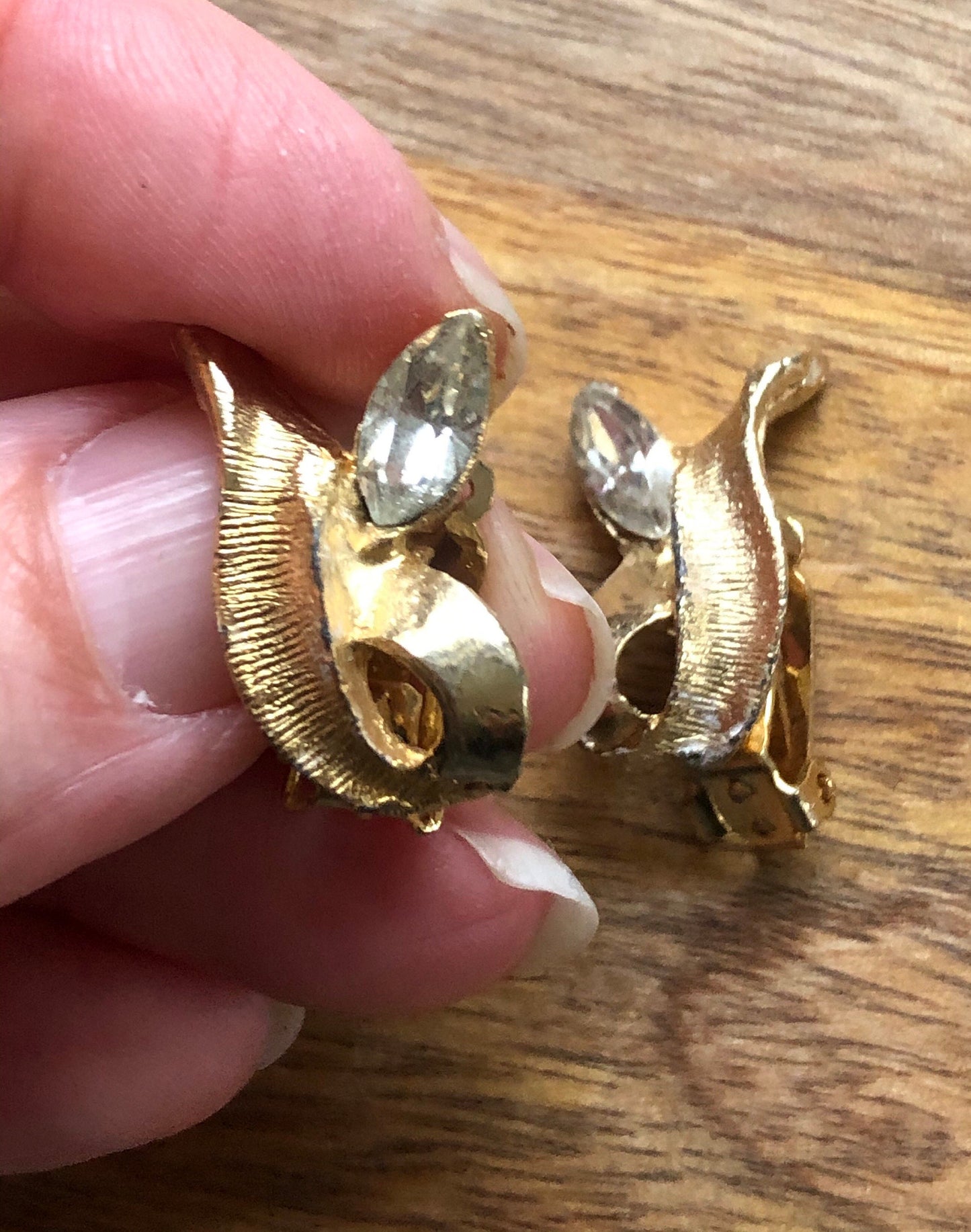 Vintage gold and rhinestone flame clip on earrings.