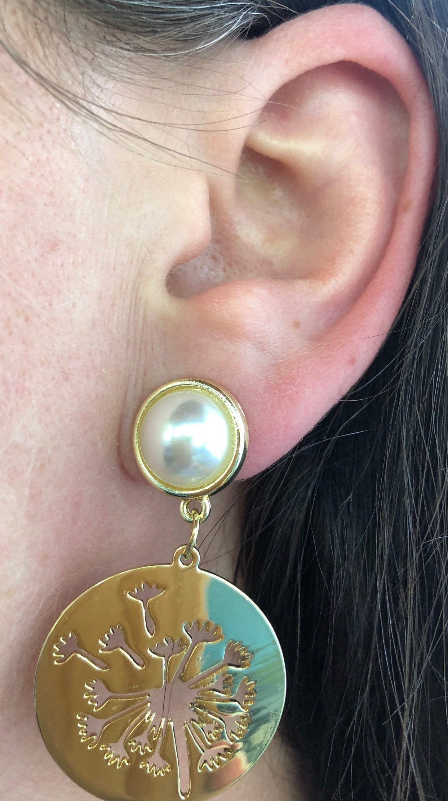 Dangling clip on faux pearl and dangling dandelion medallion earrings