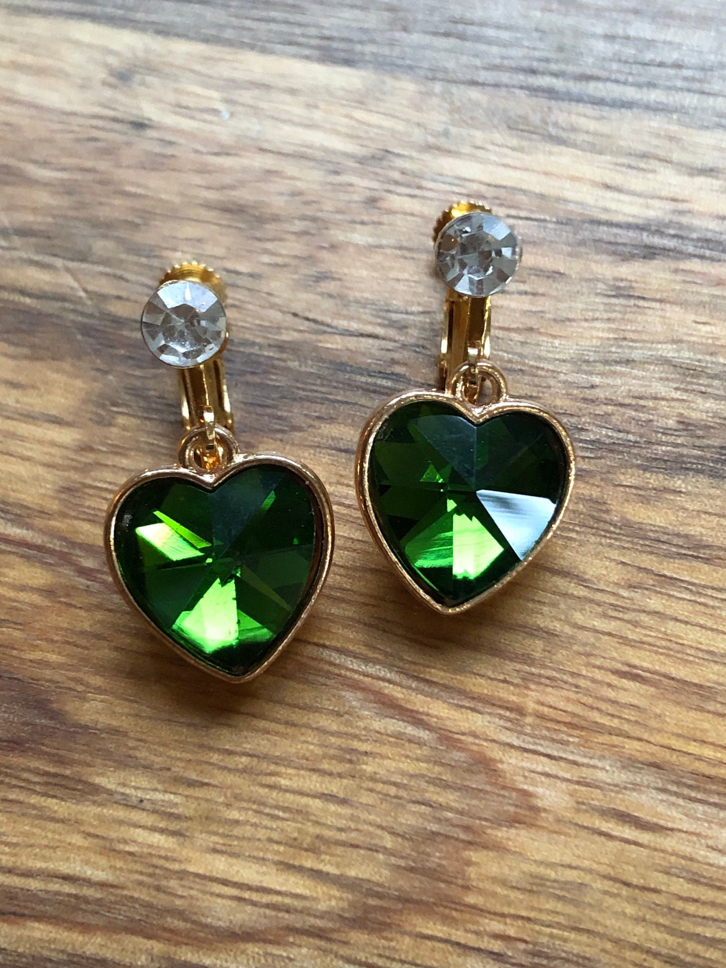 Clip on rhinestone heart earrings, dangling heart earrings with hinged screwback closures.