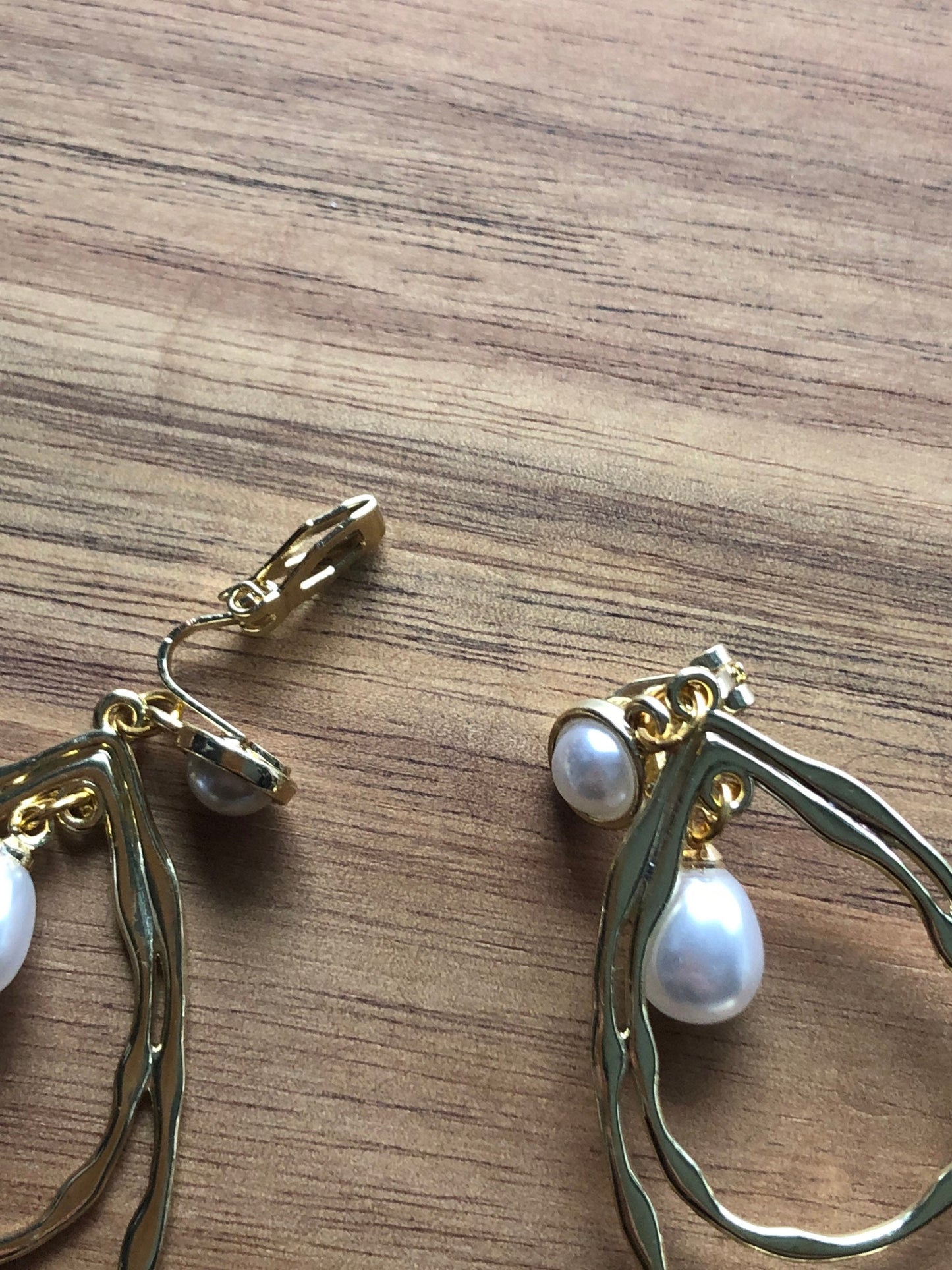 Dangling gold hoops with faux pearls clip on earrings