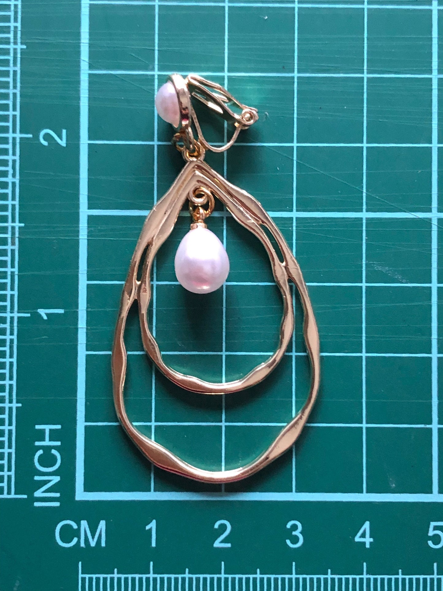 Dangling gold hoops with faux pearls clip on earrings