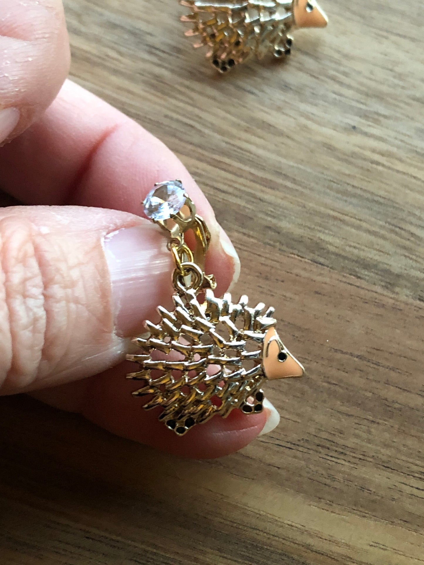 Dangling golden hedgehog clip on earrings