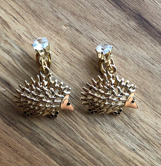 Dangling golden hedgehog clip on earrings