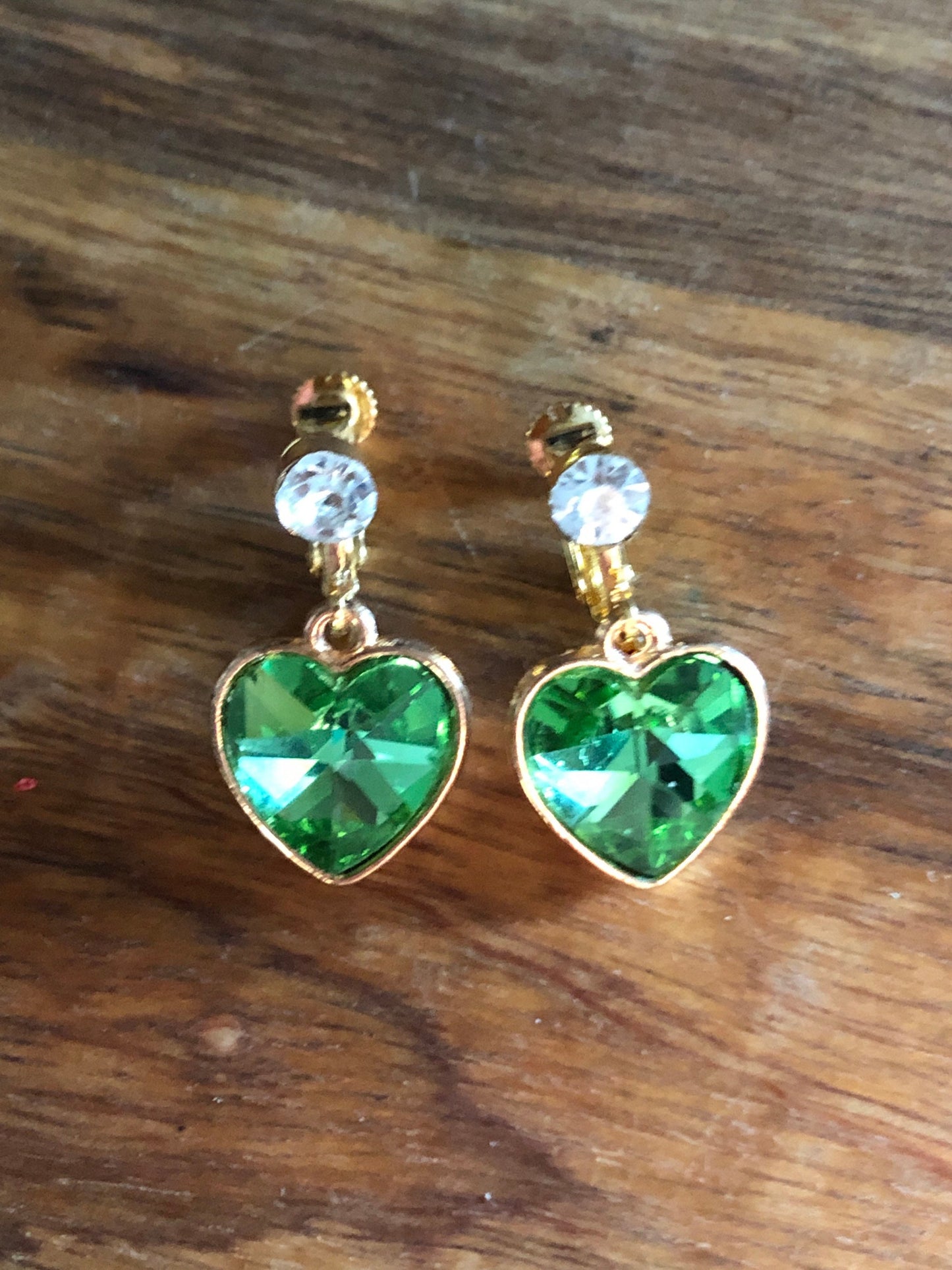 Clip on rhinestone heart earrings, dangling heart earrings with hinged screwback closures.