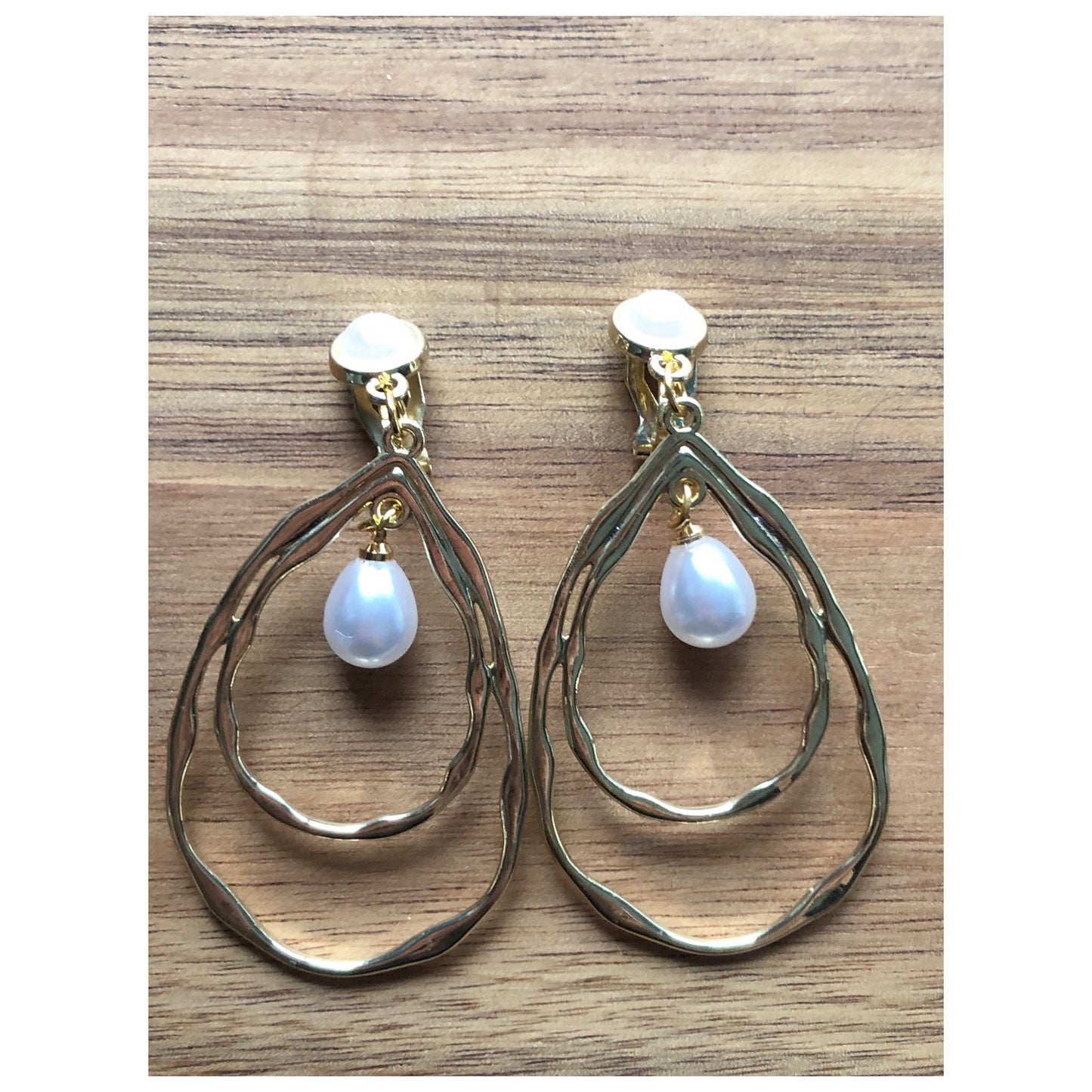 Dangling gold hoops with faux pearls clip on earrings