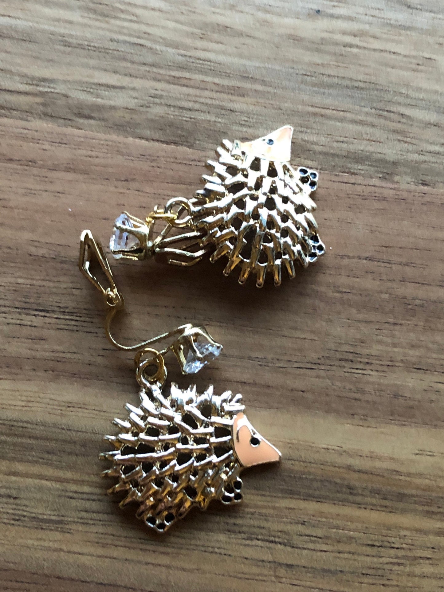 Dangling golden hedgehog clip on earrings