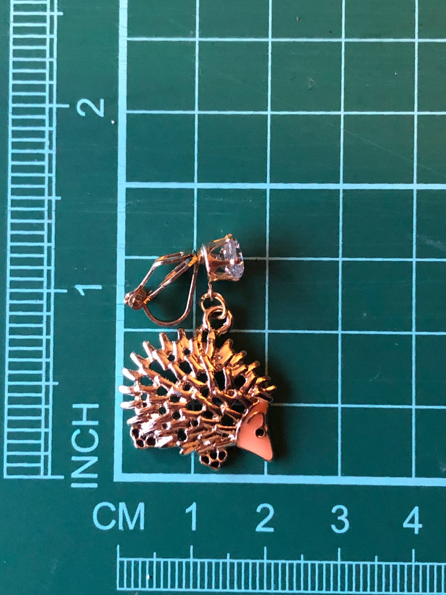 Dangling golden hedgehog clip on earrings