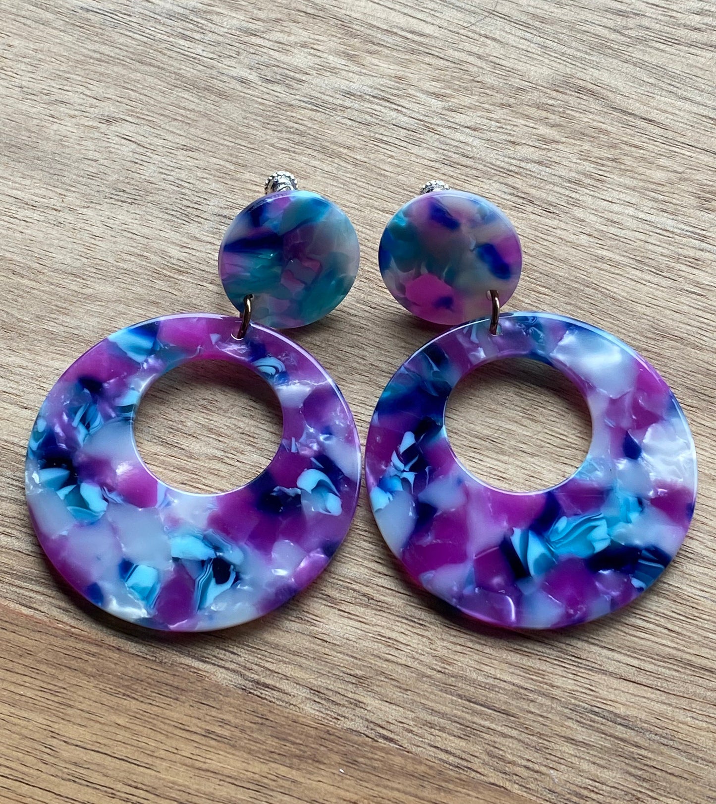 dangling purple clip on tortoiseshell hoops