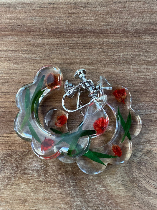 Clip on hoop earrings - clear with suspended red or yellow flowers (screwback)