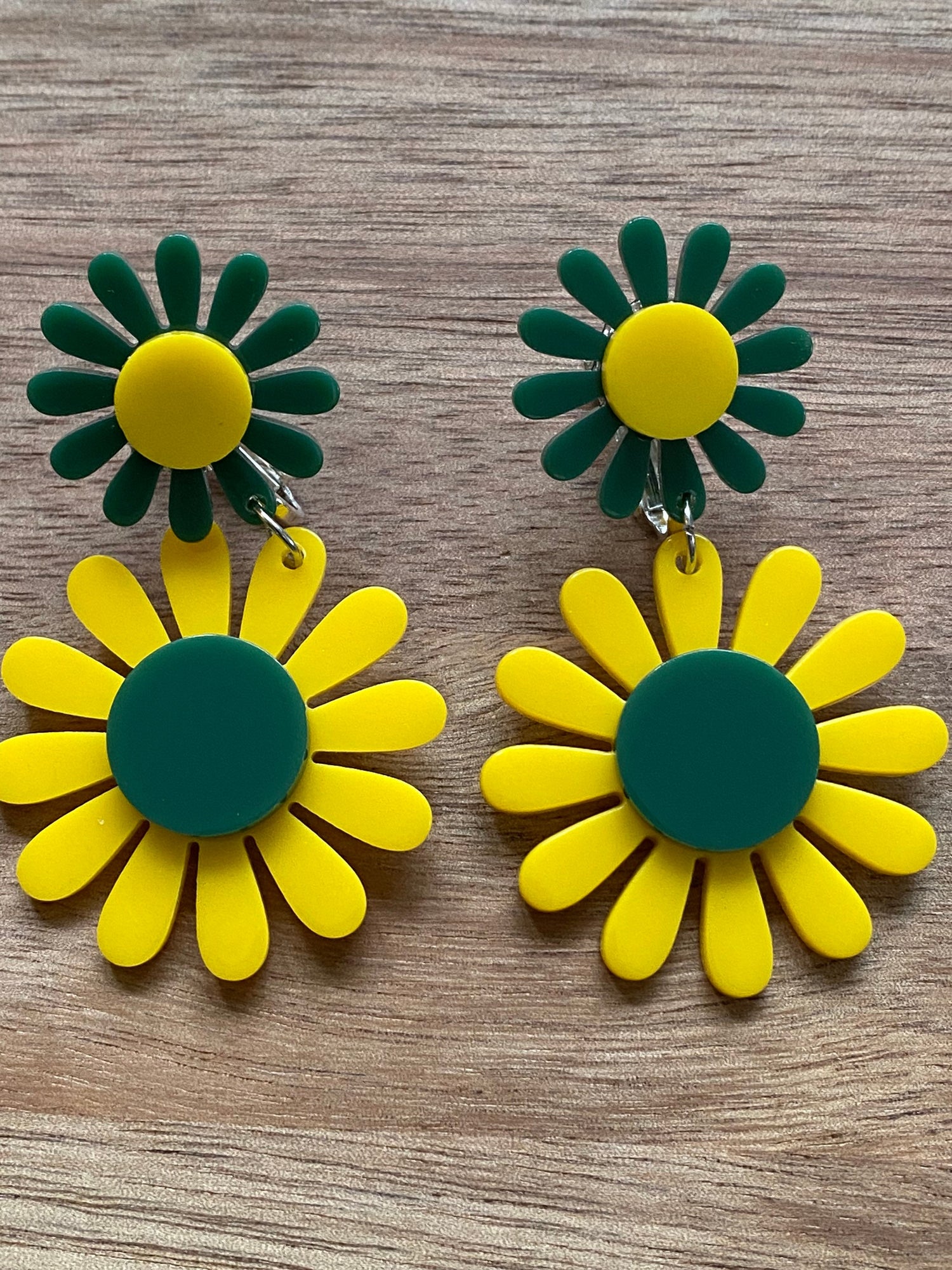 dangling yellow and green clip on daisy earrings