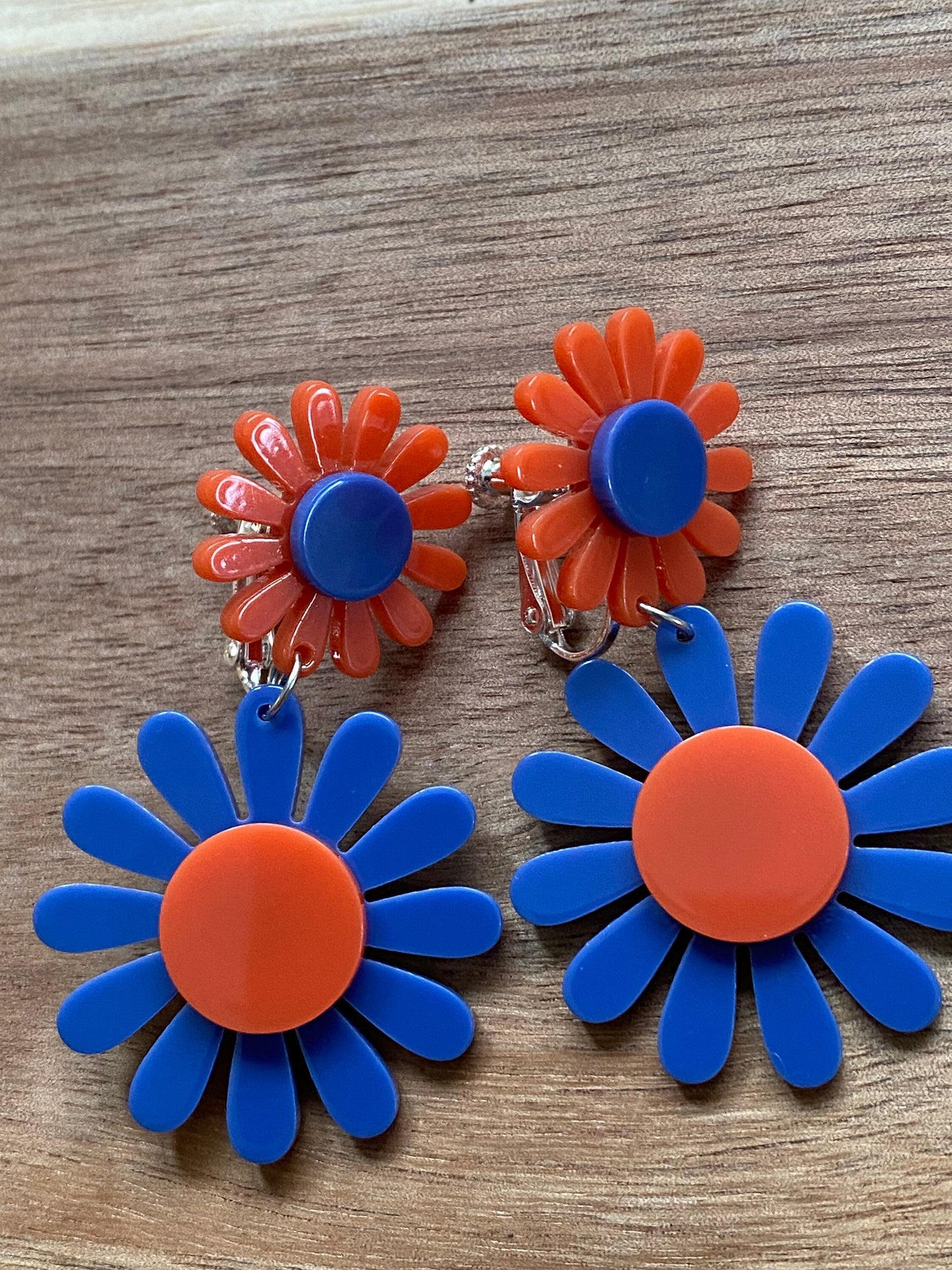 dangling red and blue clip on daisy earrings