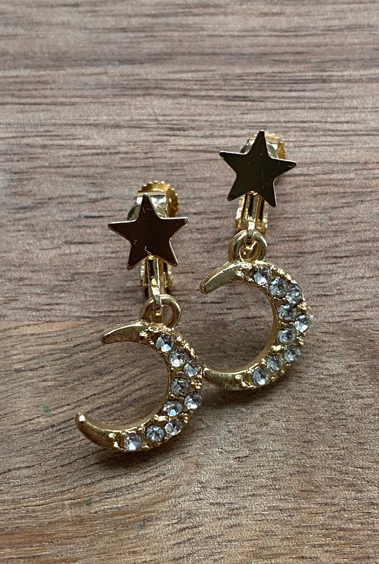 dangling star and crescent moon clip on earrings