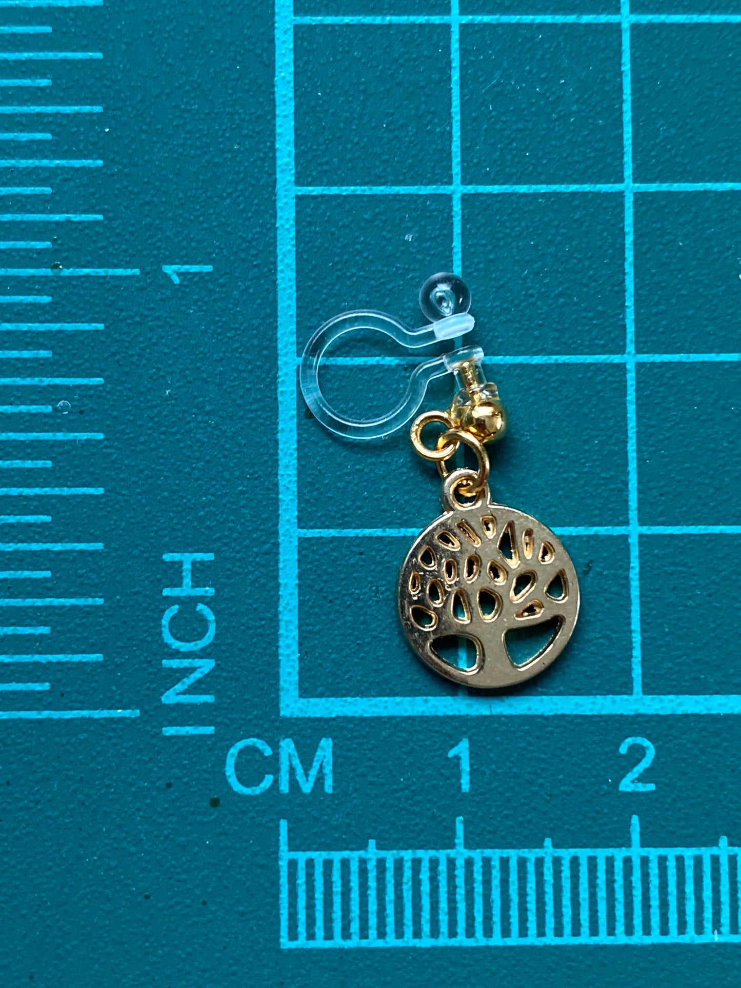 Dangling invisible clip on earrings (no piercing no pierce) with golden tree pendants