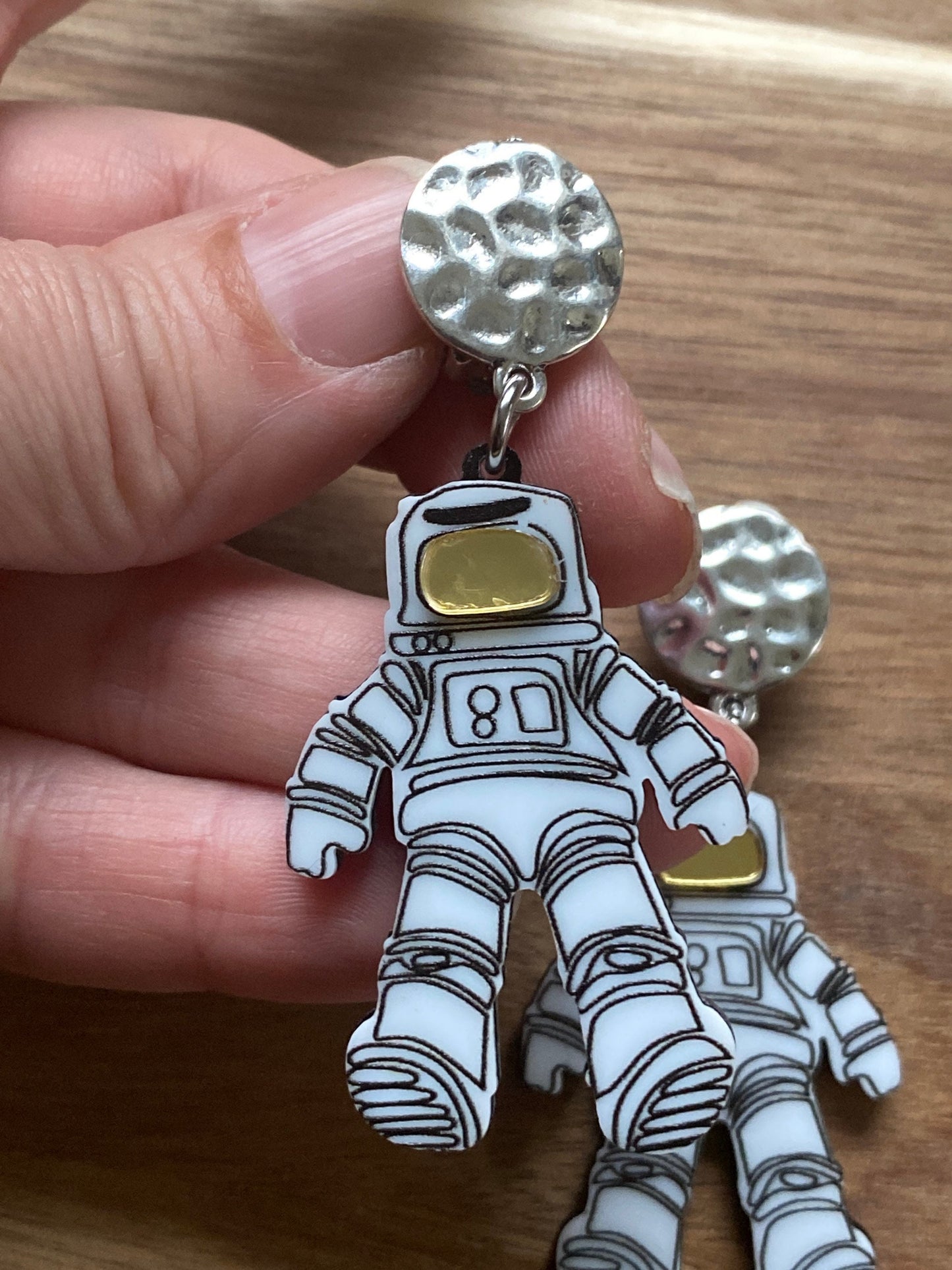 Dangling astronaut clip on earrings, outer space earrings