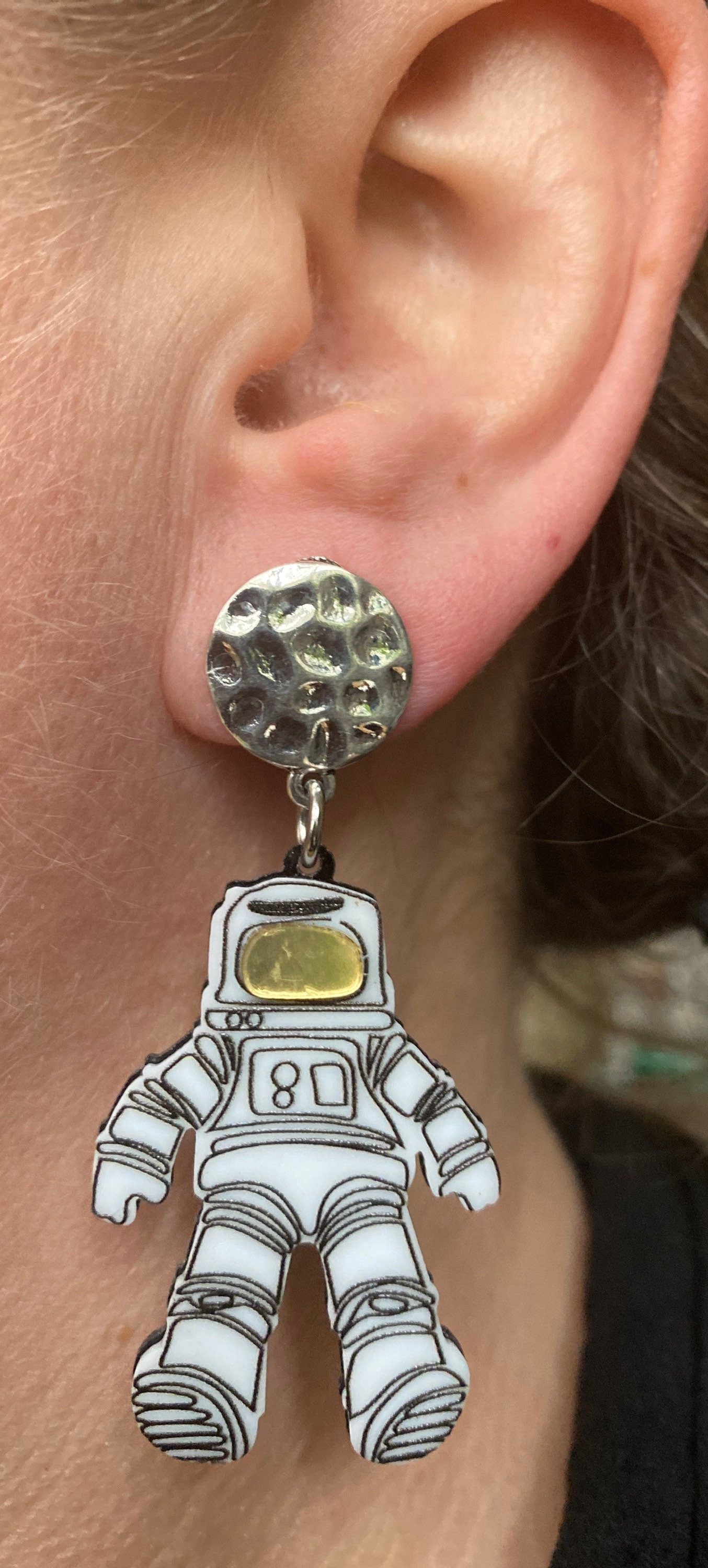 Dangling astronaut clip on earrings, outer space earrings