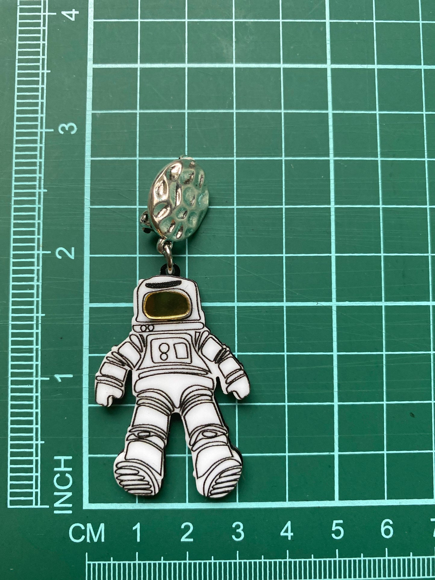 Dangling astronaut clip on earrings, outer space earrings