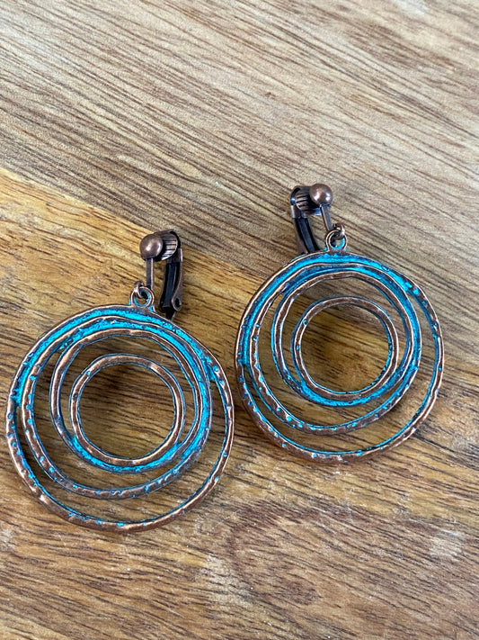 dangling rustic clip on hoop earrings, copper patina