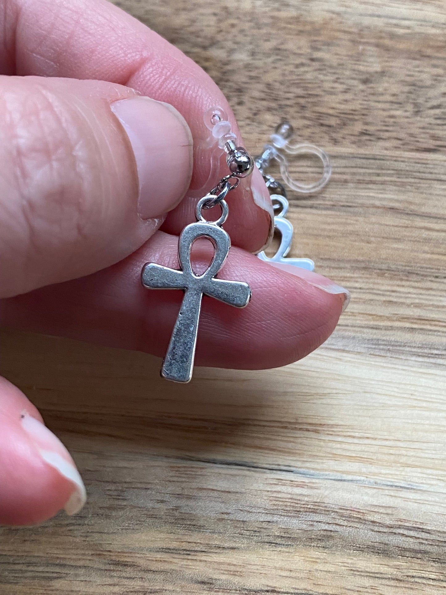 Dangling ankh invisible clip on earrings, silver symbol earrings on plastic closures