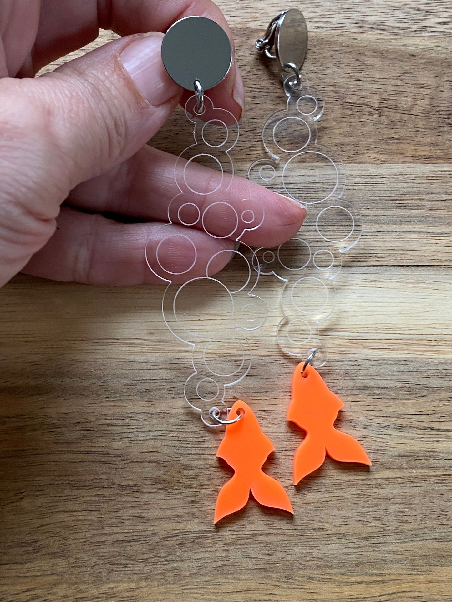 Dangling plastic goldfish clip on earrings, long novelty earrings