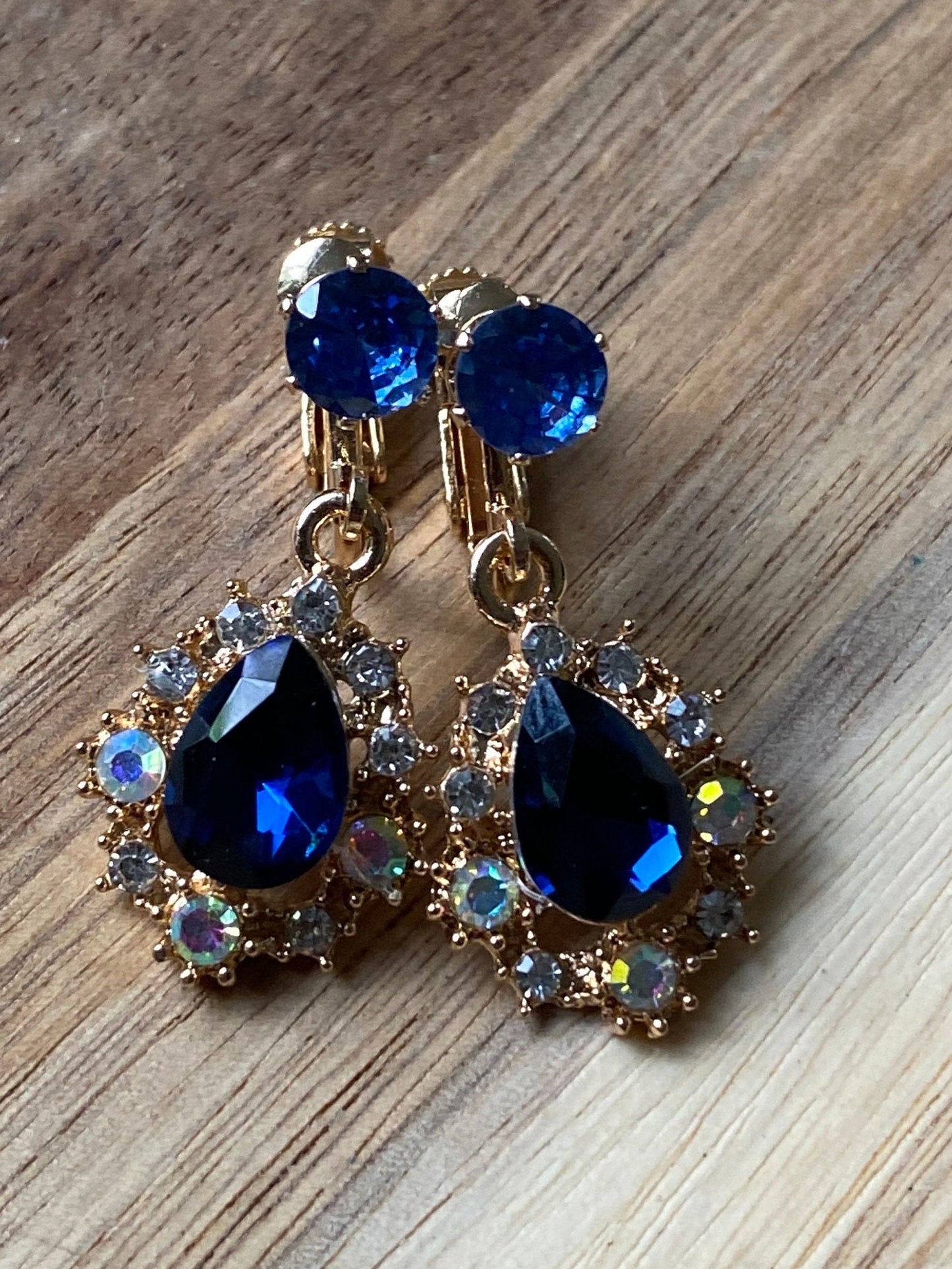 Dangling sparkling rhinestone clip on earrings, small rhinestone earrings with hinged screwback closures, blue rhinestone