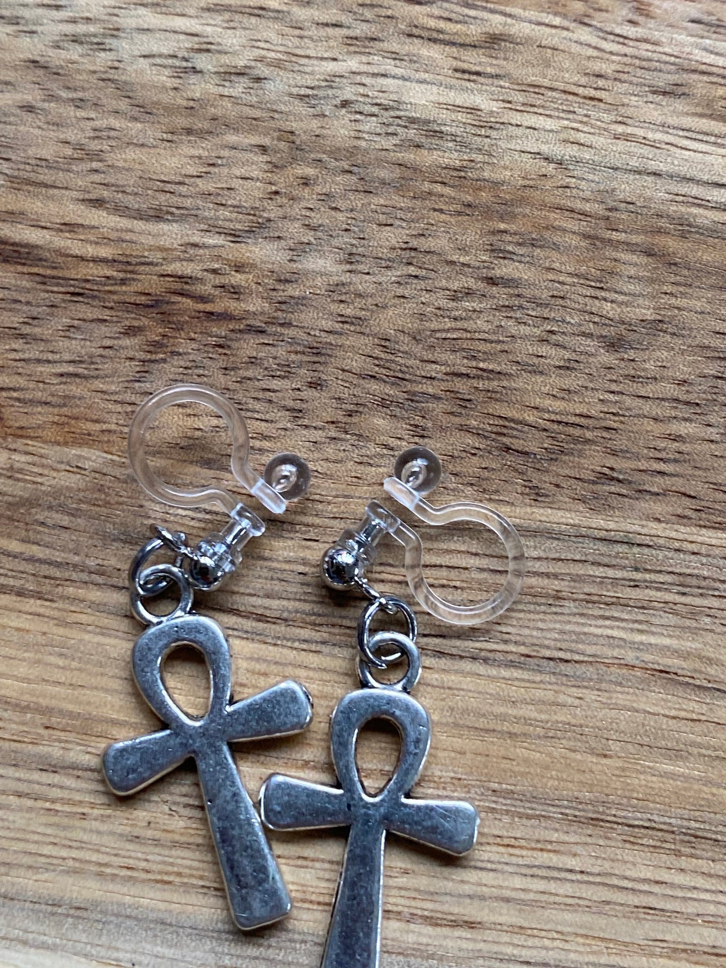 Dangling ankh invisible clip on earrings, silver symbol earrings on plastic closures