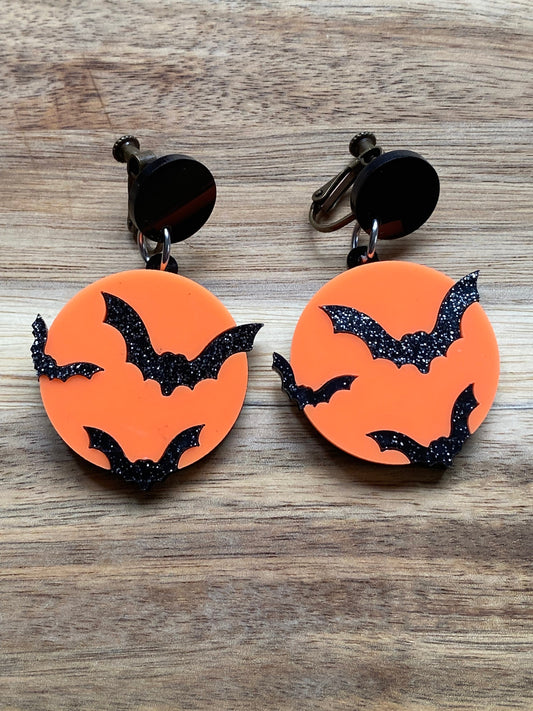 Dangling bats and orange moon clip on earrings (no piercing | screwback)