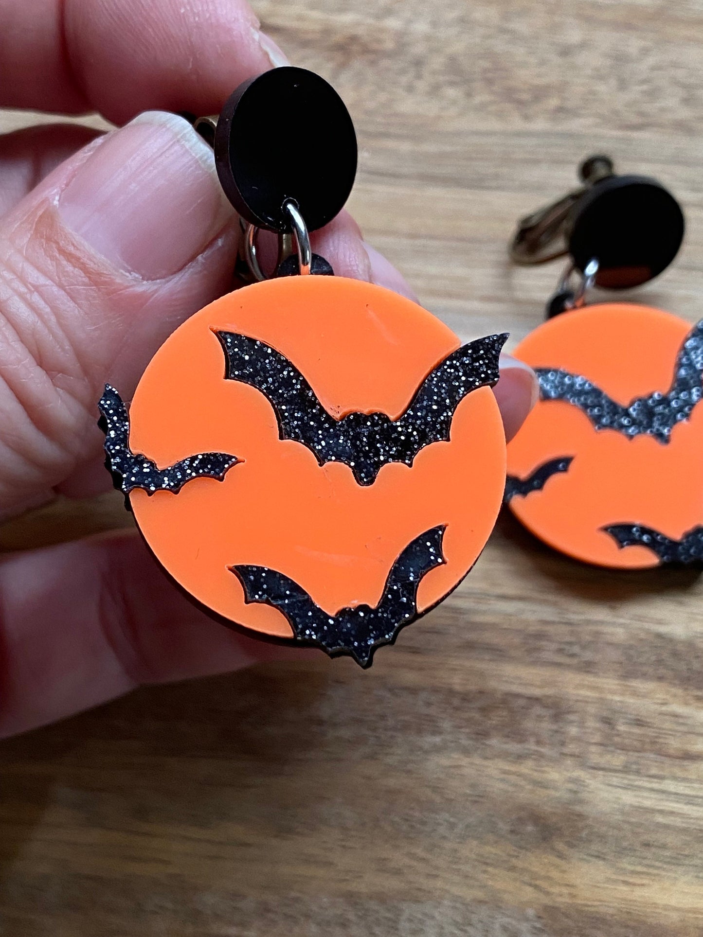 Dangling bats and orange moon clip on earrings (no piercing | screwback)