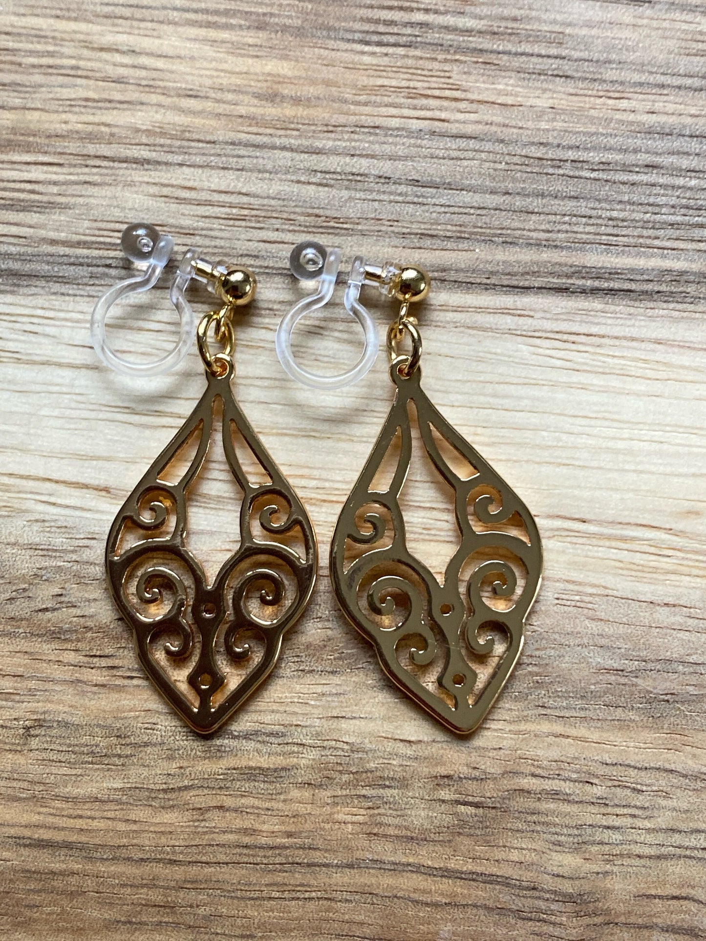 dangling golden clip on earrings. invisible clip on earrings