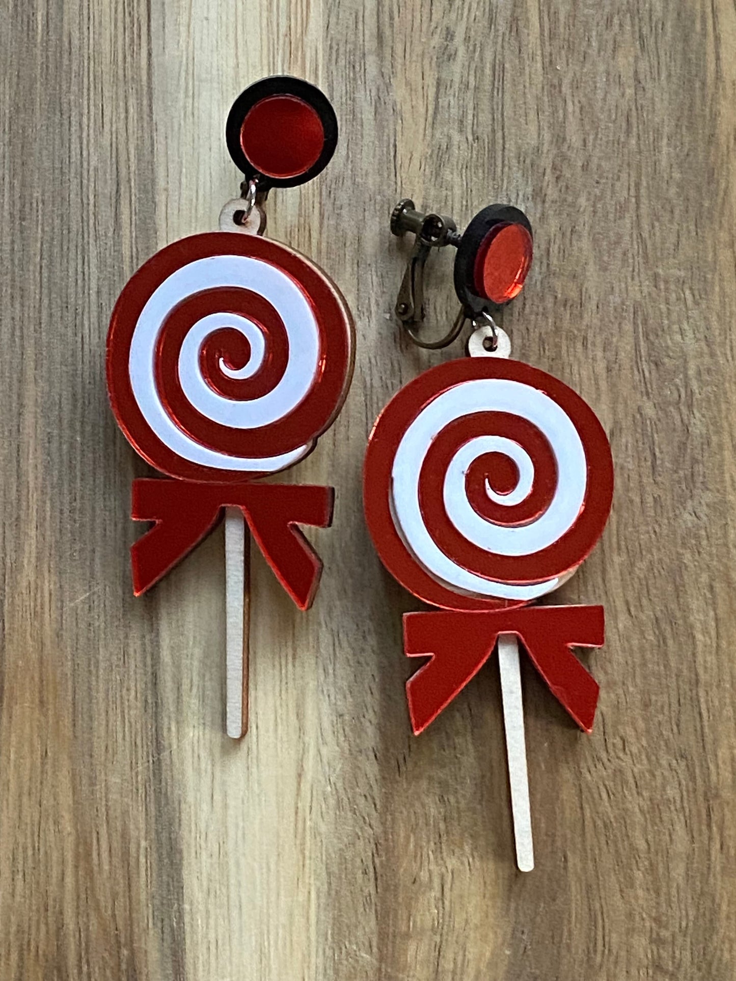 Dangling Christmas candy clip on earrings, giant plastic lollipop earrings with hinged screwback closures.