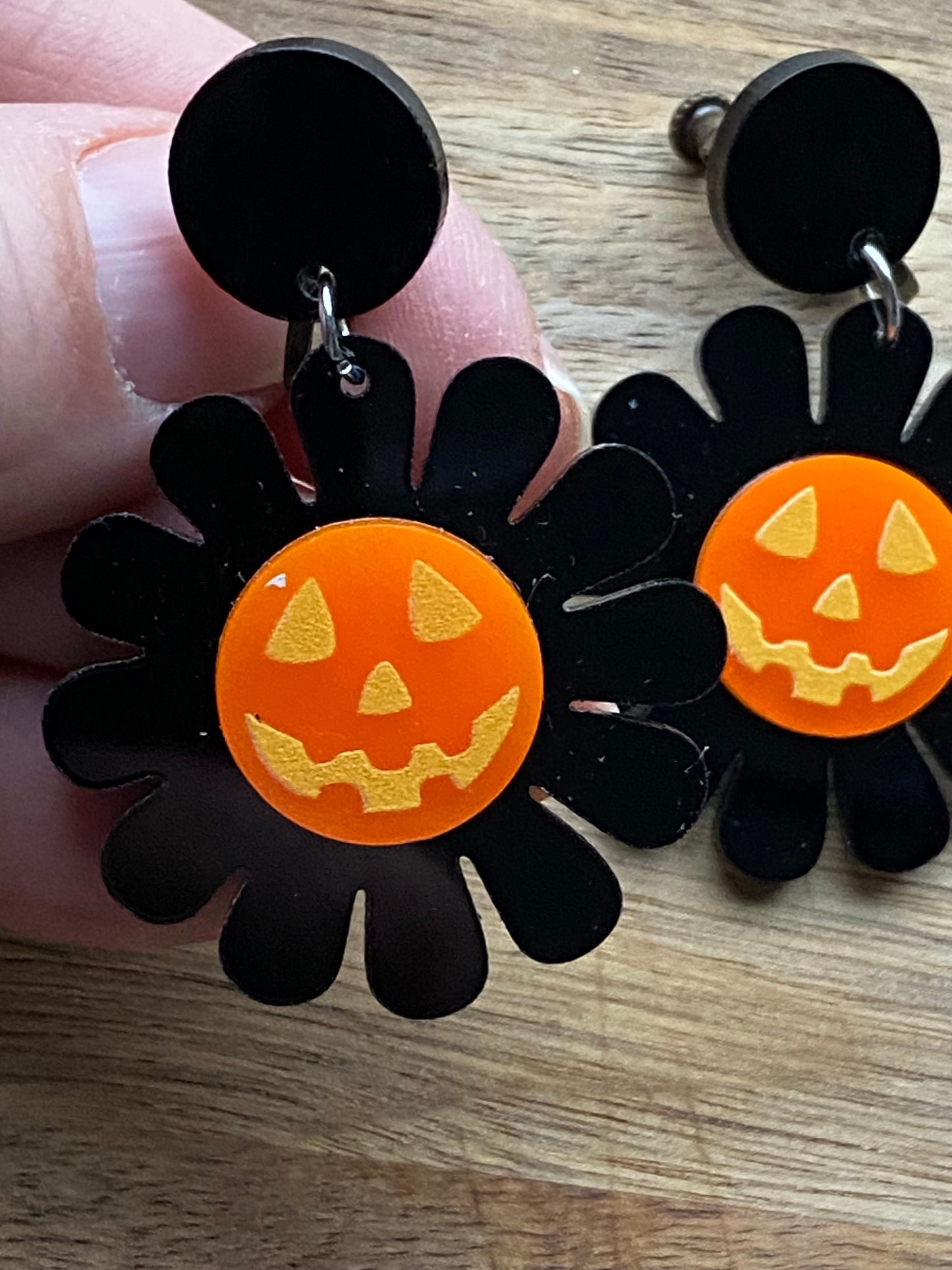 Dangling clip on earrings, Halloween black and orange daisies