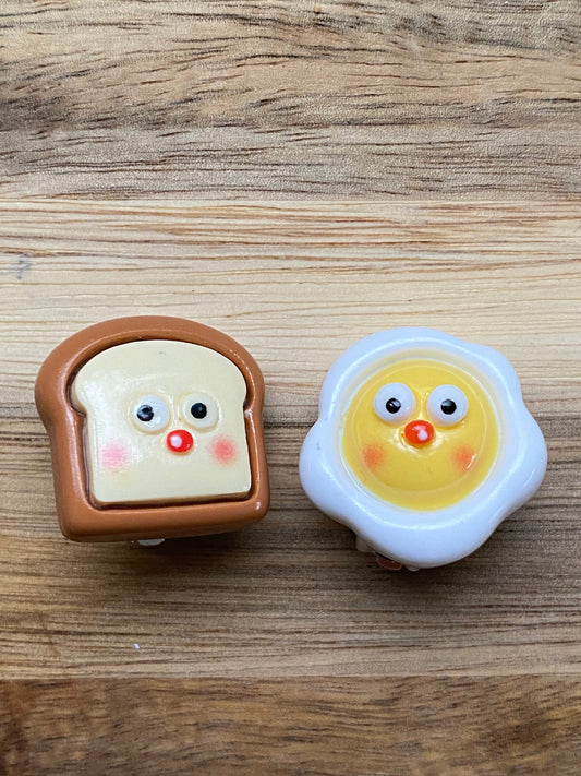 Asymmetrical breakfast clip on earrings, kawaii  eggs and toast with clip closures.