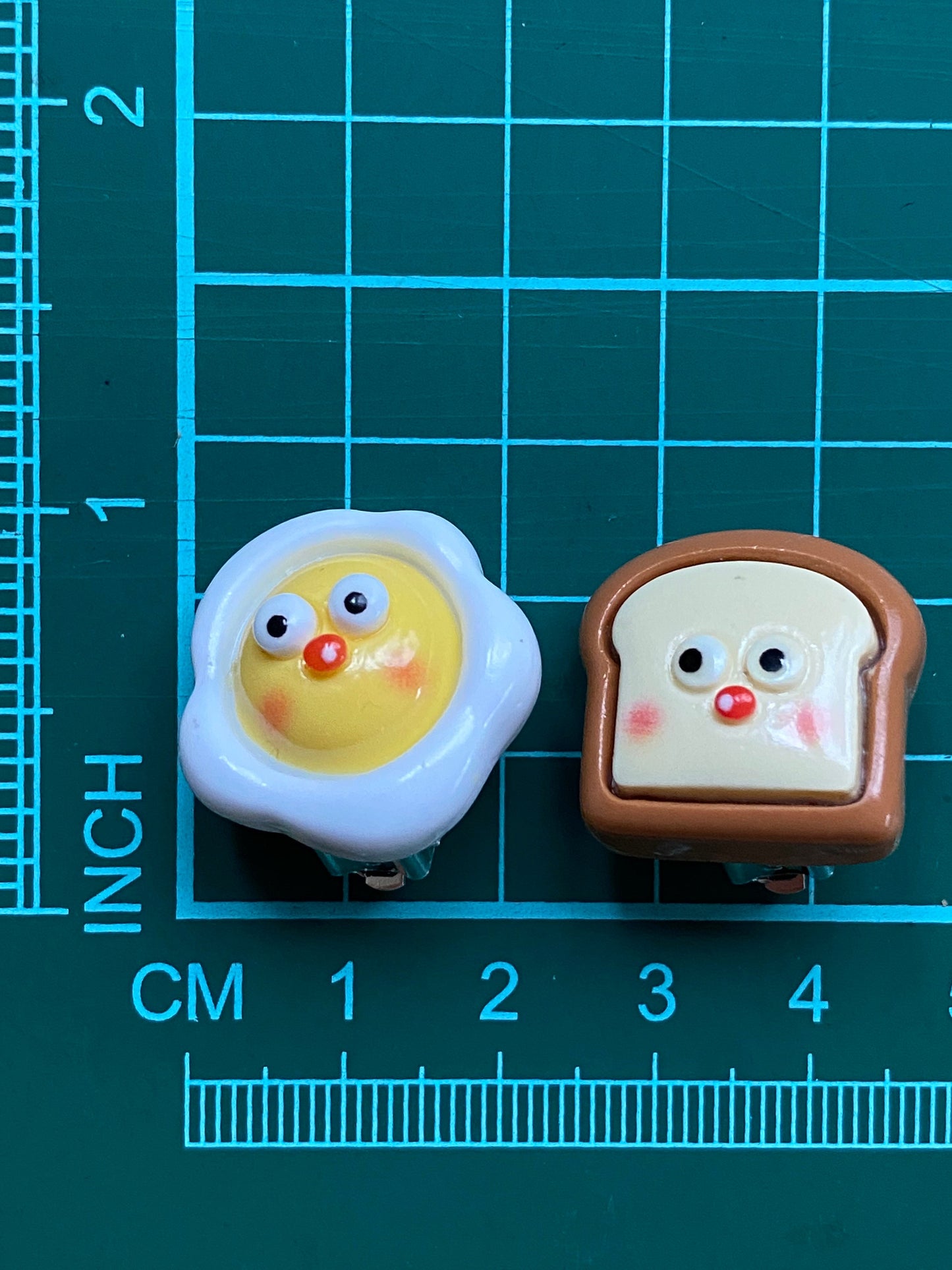 Asymmetrical breakfast clip on earrings, kawaii  eggs and toast with clip closures.