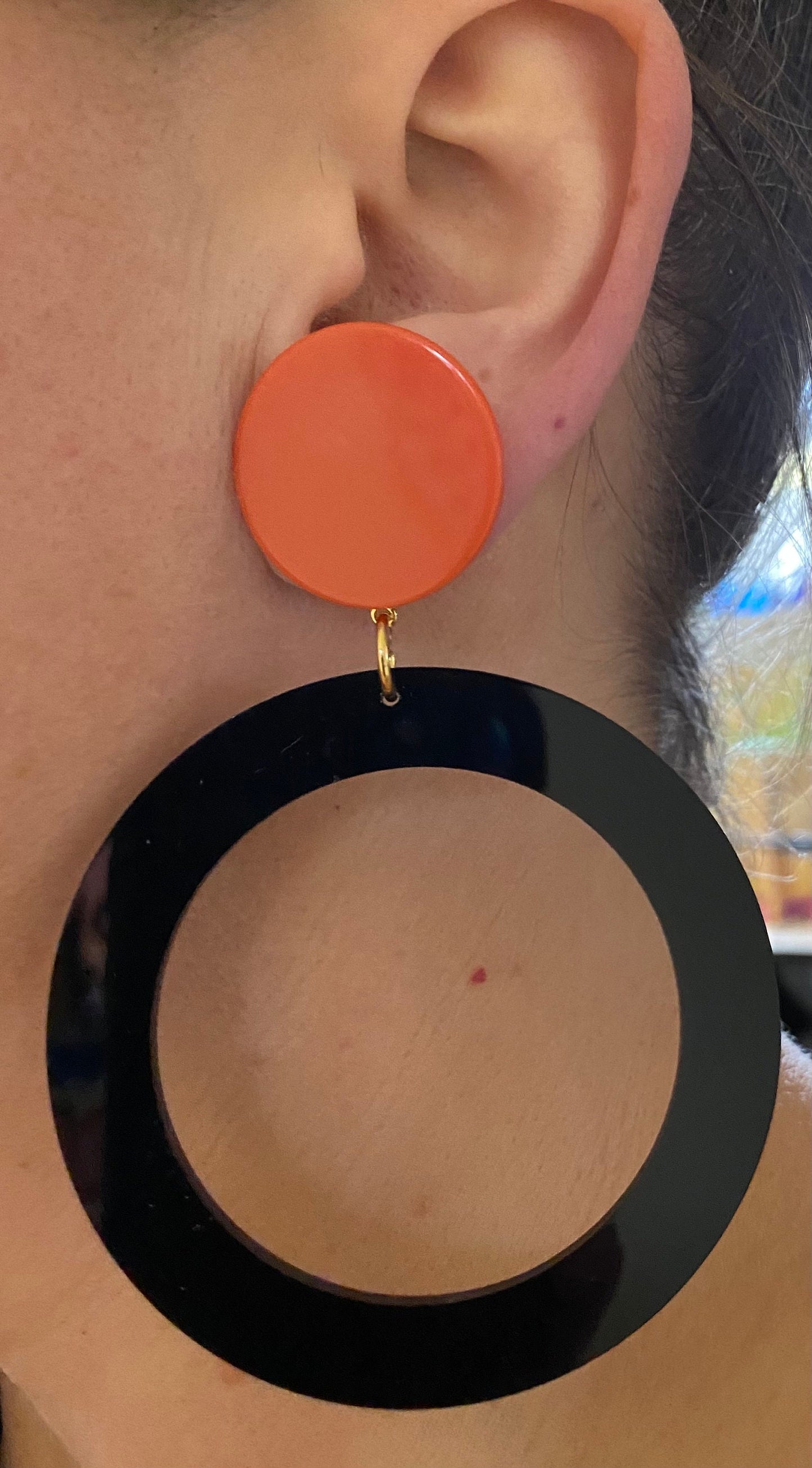 Giant modern clip on drop  plastic hoop earrings, black and tangerine hoops