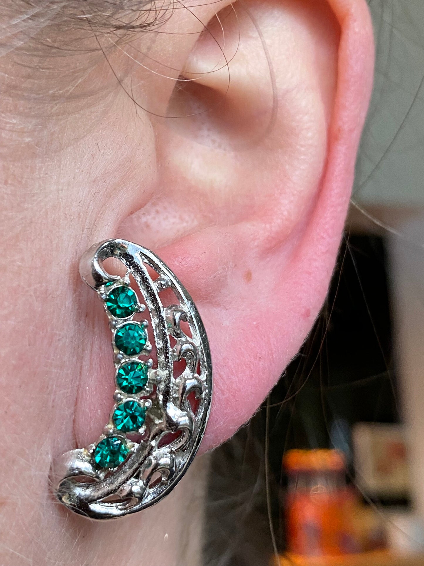 Vintage silver and green rhinestone clip on earrings, faux emerald screwback crescents