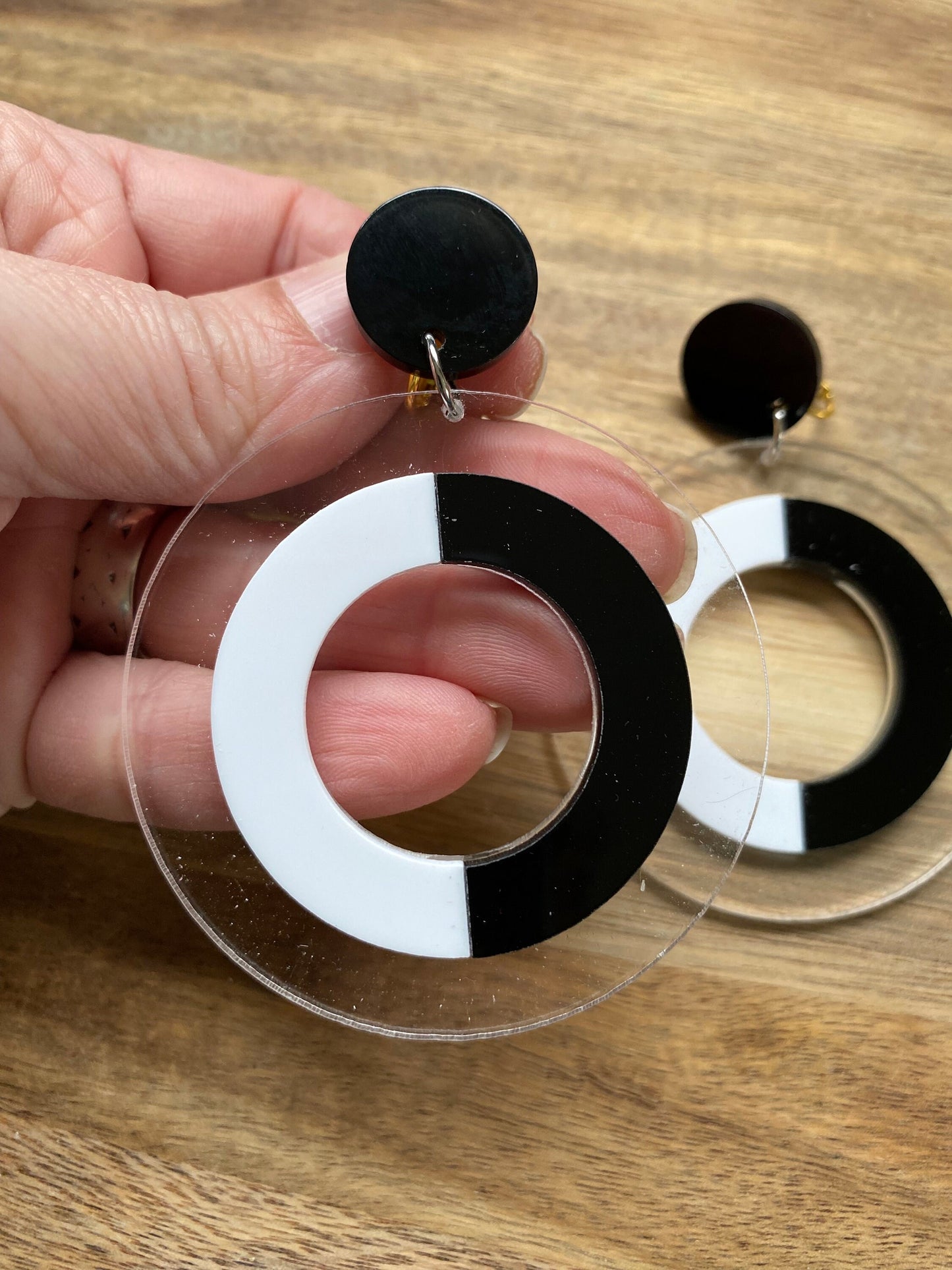 Oversized clip on black and white plastic hoop earrings