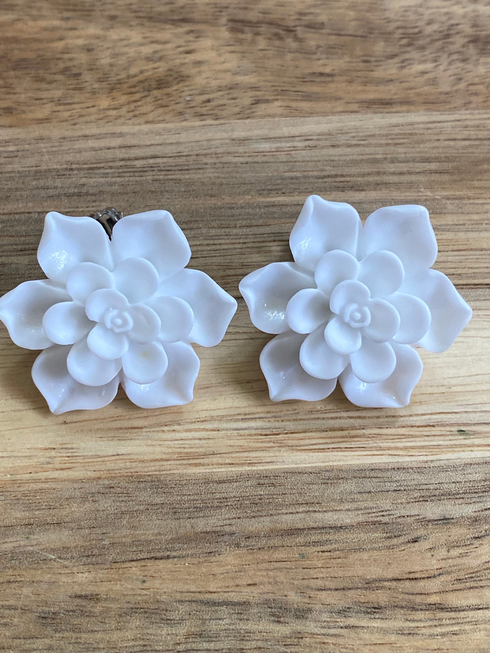 white floral clip on earrings