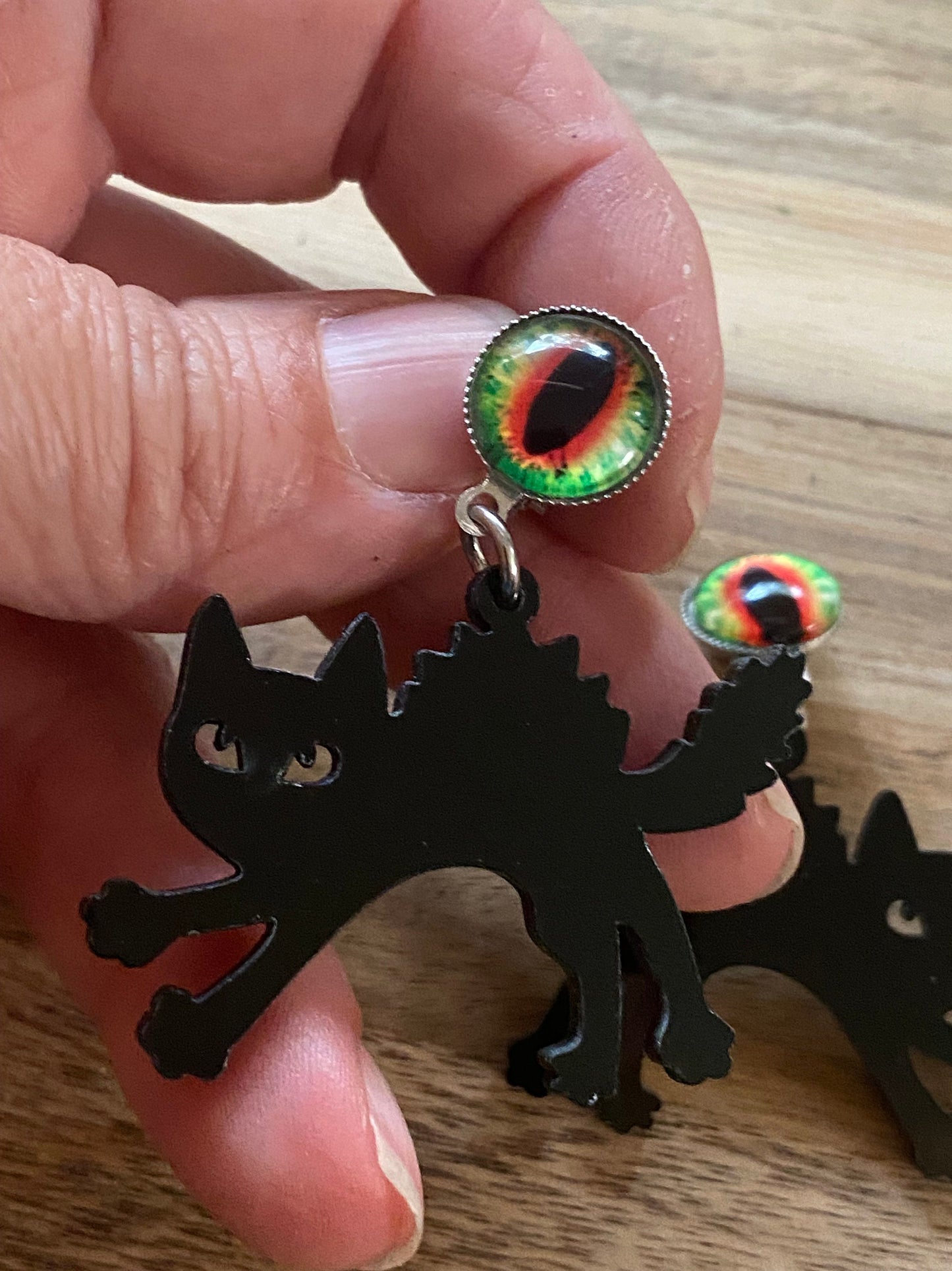 Dangling clip on cat eye black cat Halloween earrings