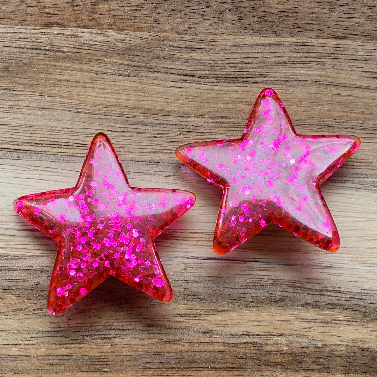 Big chunky plastic glitter clip on red star earrings