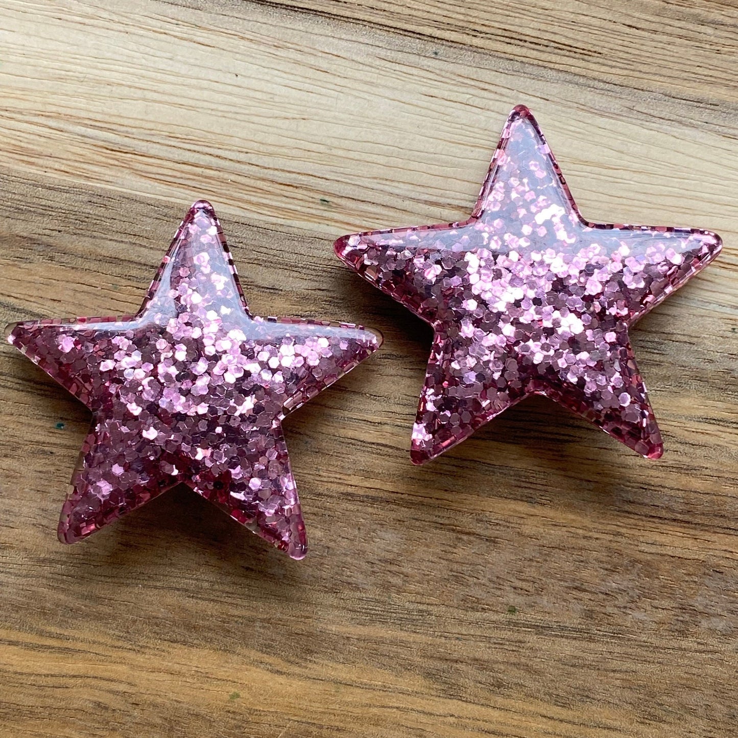 Big chunky plastic glitter clip on red star earrings