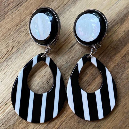 Dangling black and white striped plastic teardrop hoop clip on earrings