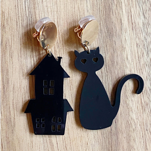 Dangling plastic black cat and haunted house Halloween clip on earrings