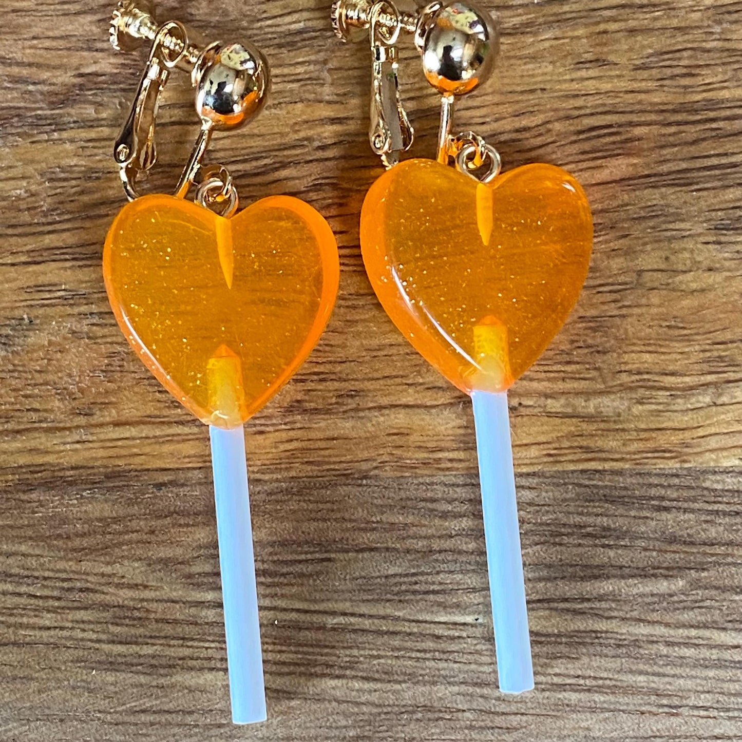 Dangling lollipop clip on earrings,  plastic heart  lollipop earrings with hinged screwback closures.