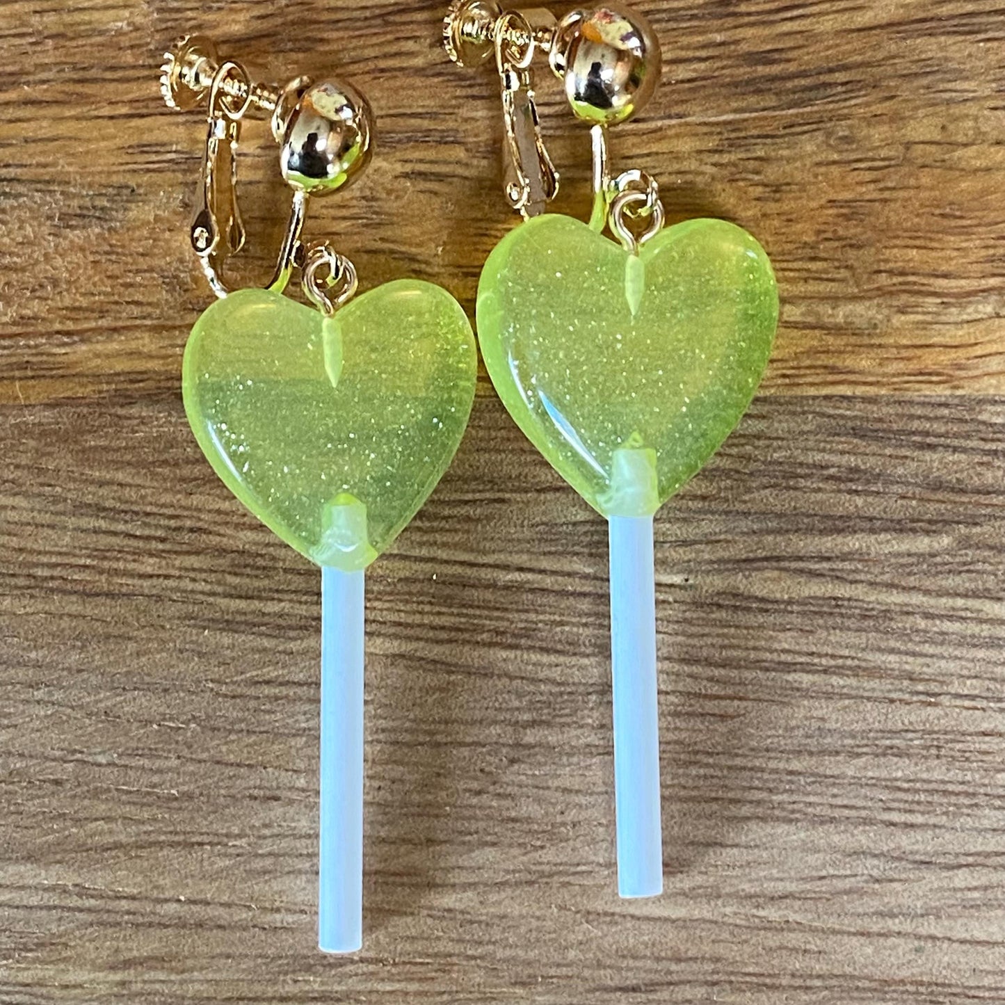 Dangling lollipop clip on earrings,  plastic heart  lollipop earrings with hinged screwback closures.