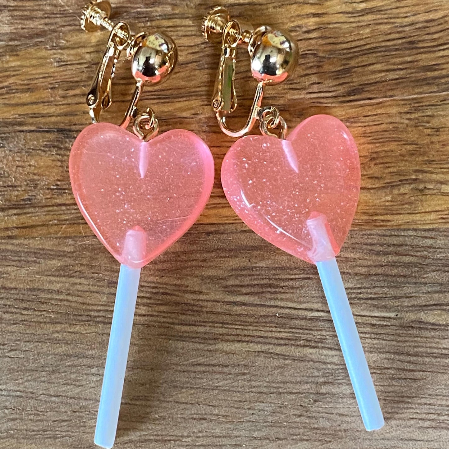 Dangling lollipop clip on earrings,  plastic heart  lollipop earrings with hinged screwback closures.