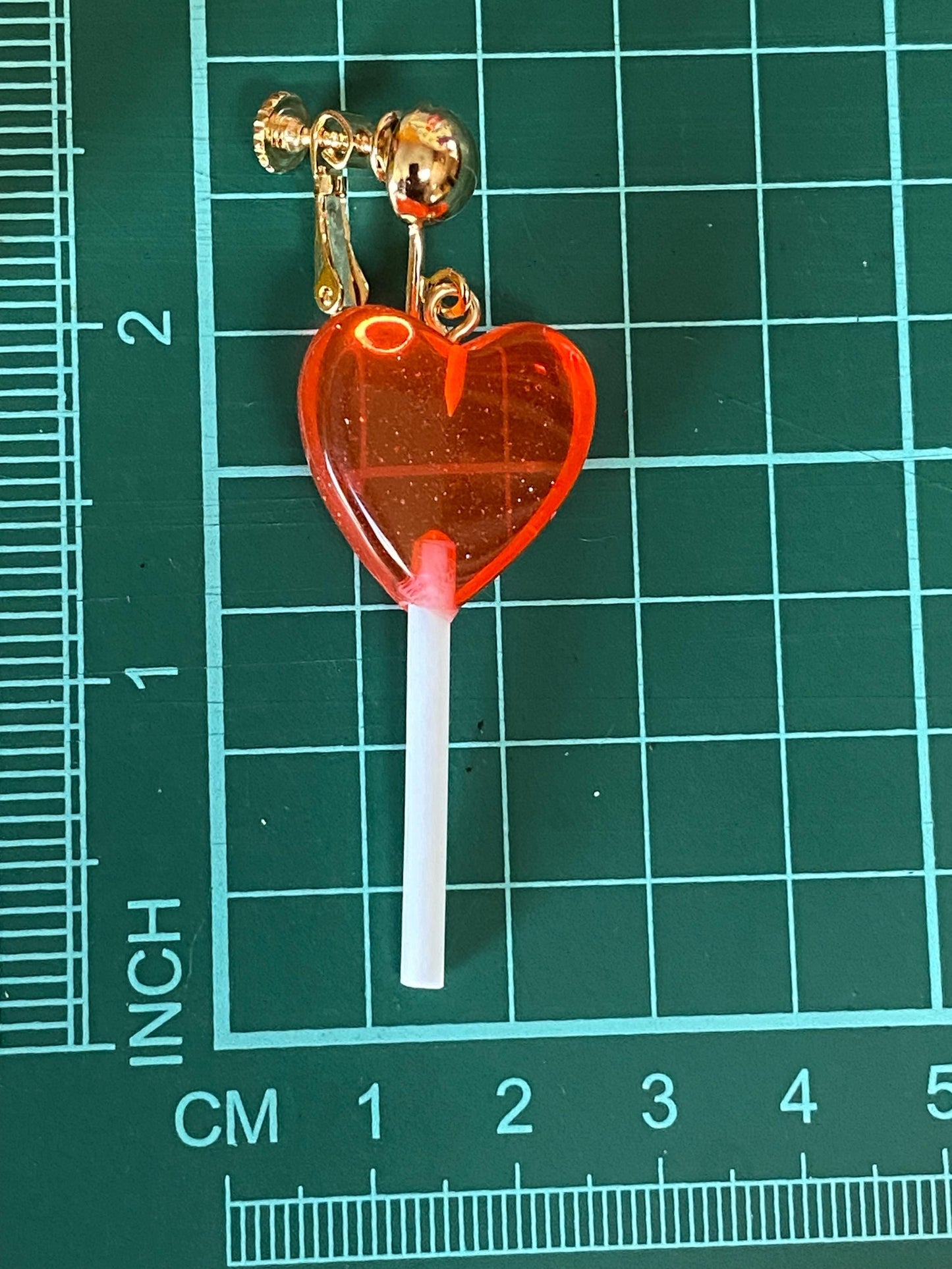 Dangling lollipop clip on earrings,  plastic heart  lollipop earrings with hinged screwback closures.