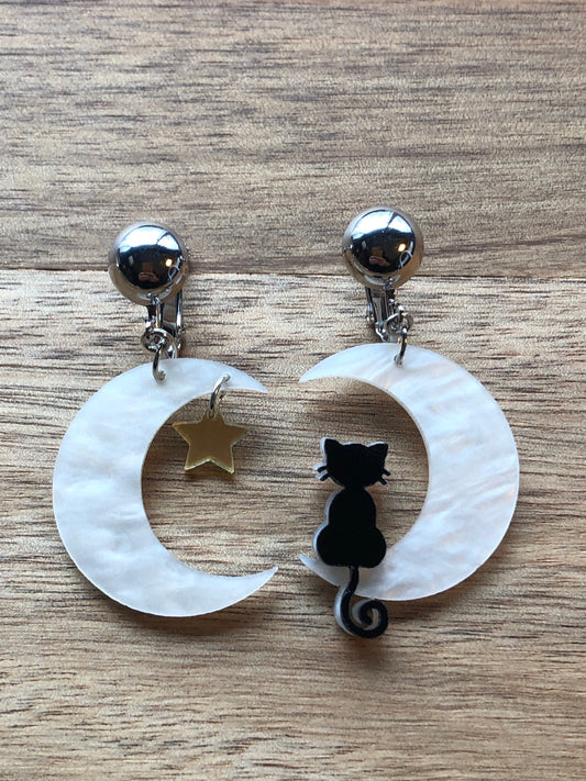 Black cat on a crescent moon clip on earrings