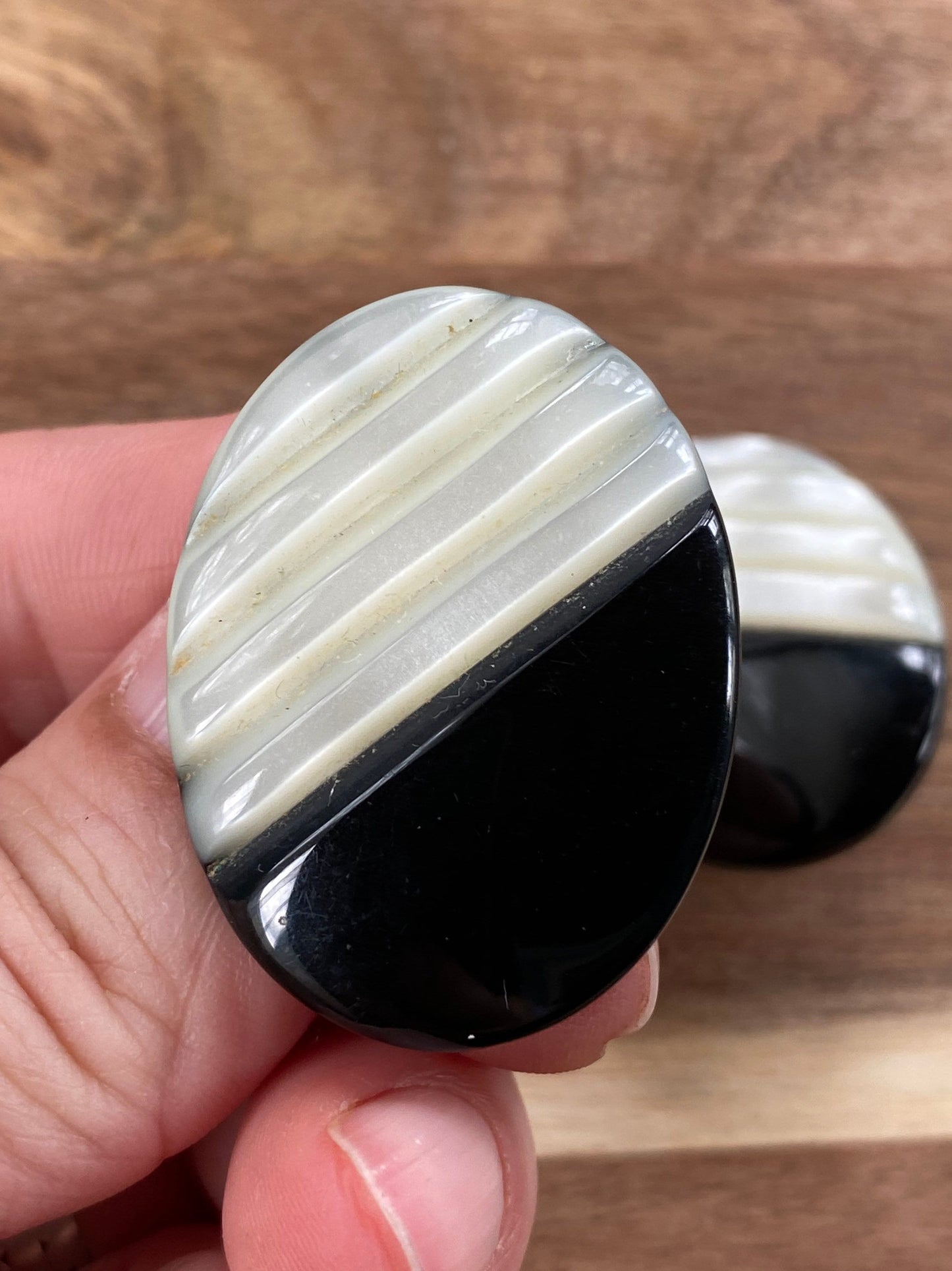 Vintage carved mother of pearl and black plastic clip on earrings